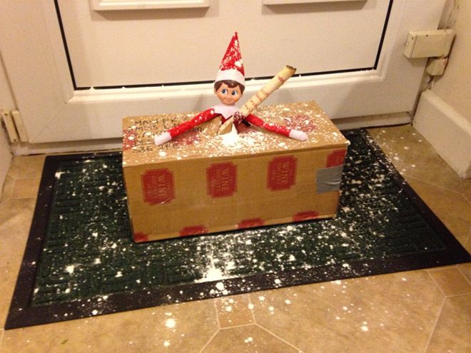 Elf on a shelf arrives by bursting out of a package from Santa Claus at the north pole.