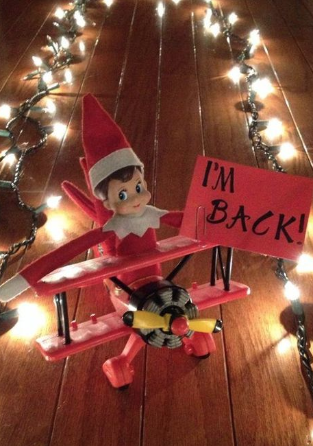 elf on the shelf arrives by airplane with christmas lights runway