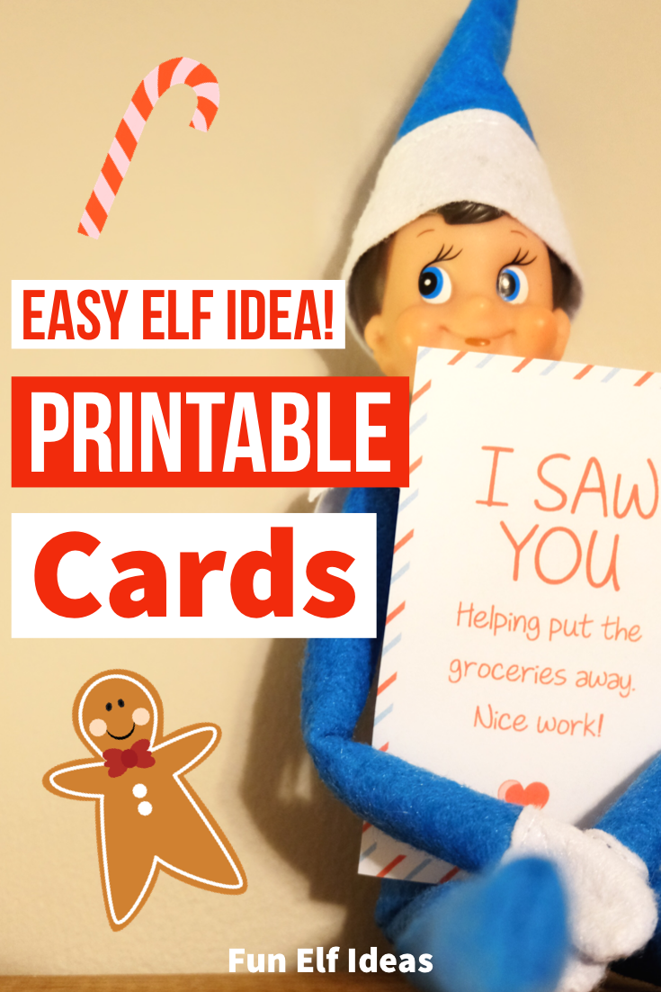 Blue-clothed elf on the shelf holding a message card made from a printable.
